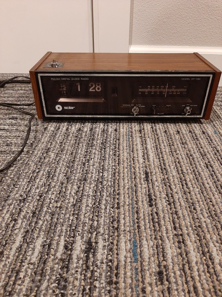 vintage Solar brand AM/FM digital flip clock radio, specifically Model DT-100