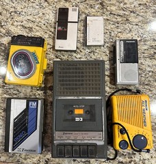 Lot of 7 Vintage FM radio/cassette or micro cassette players FOR PARTS ONLY