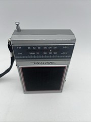 VINTAGE RADIO SHACK REALISTIC AM/ FM PORTABLE RADIO W/ STRAP TANDY CORP. WORKS